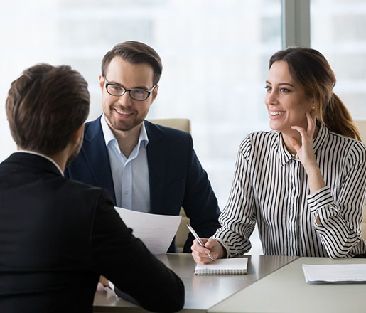 Smiling diverse HR managers satisfied about male job employee, have positive first impression of candidate, happy employers listen to applicant at interview excited of candidature. Recruitment concept